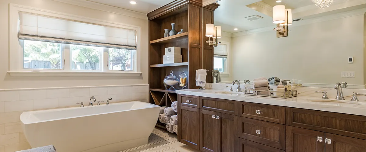 A wooden vanity and a cabinet with a free standing tub