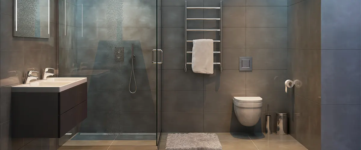 A modern bath with large gray tile on floor and walls