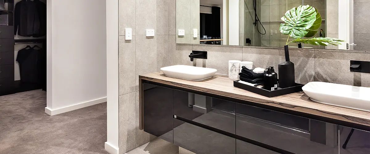 A bathroom remodel timeline with a modern double vanity and a plant