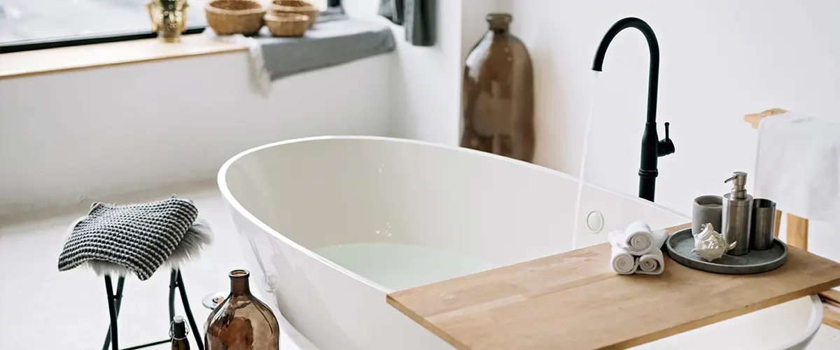 A tub with a wood table on it