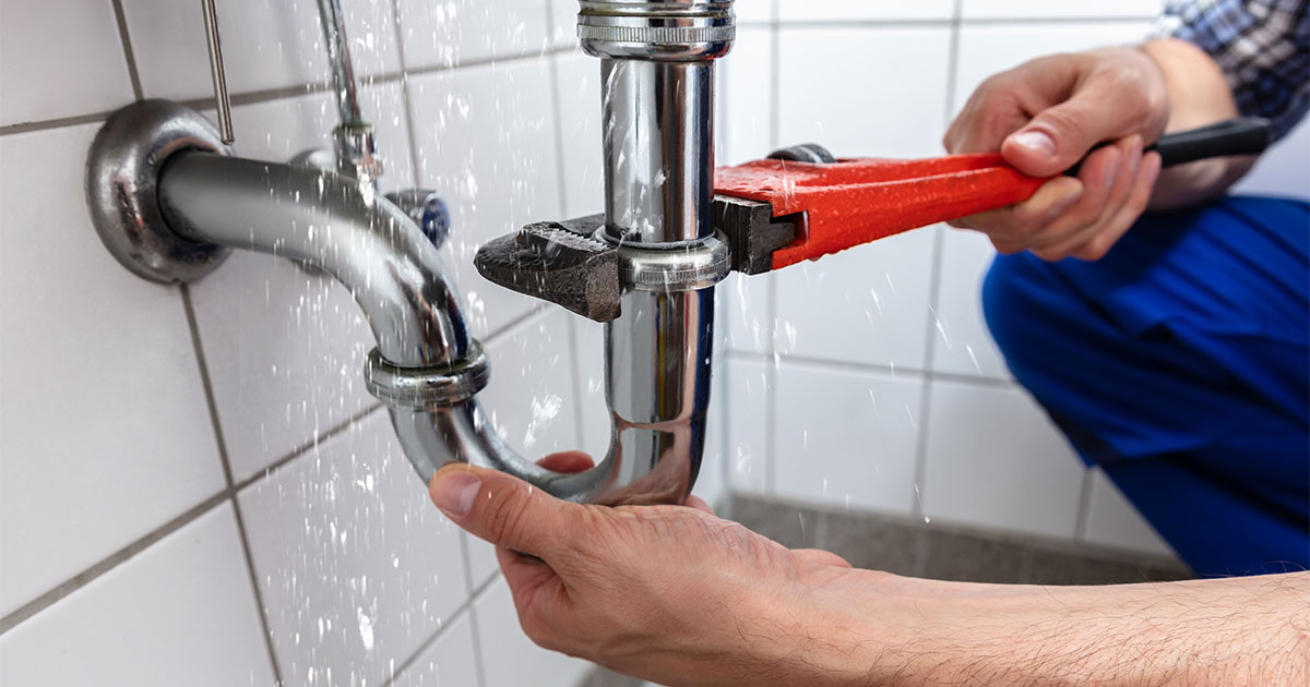 A plumber fixing common remodeling delays