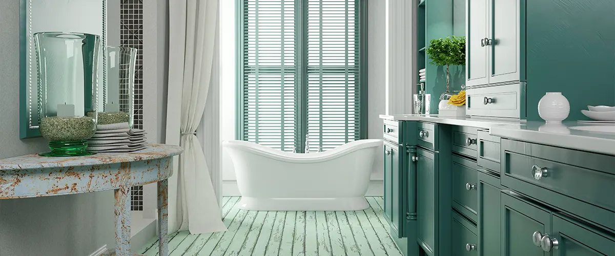 A bathroom with a lot of green and what looks to be an old hardwood floor