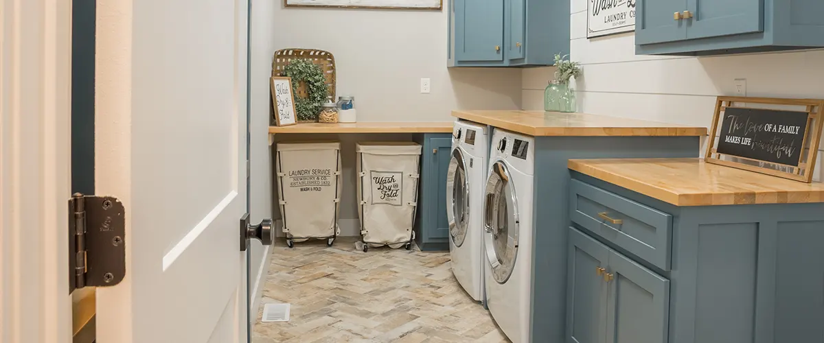 Light blue cabinets in a laundry room renovation