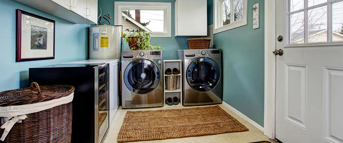 A laundry room with light blue walls