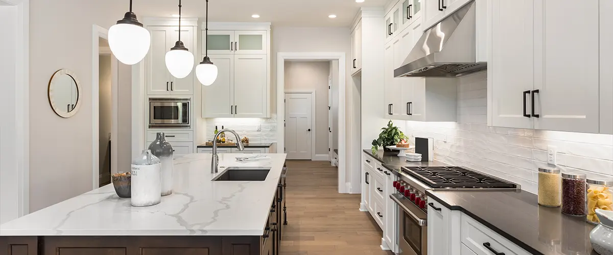 A marble countertop with overhead lighting