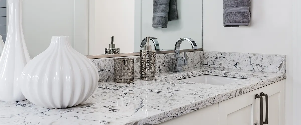 A quartz countertop with a decorative vase