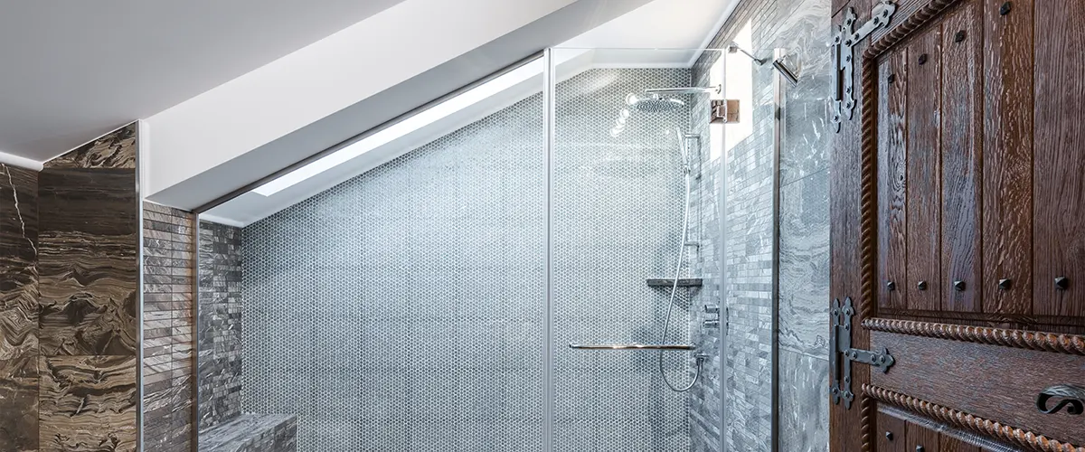 A glass shower in a smaller bath