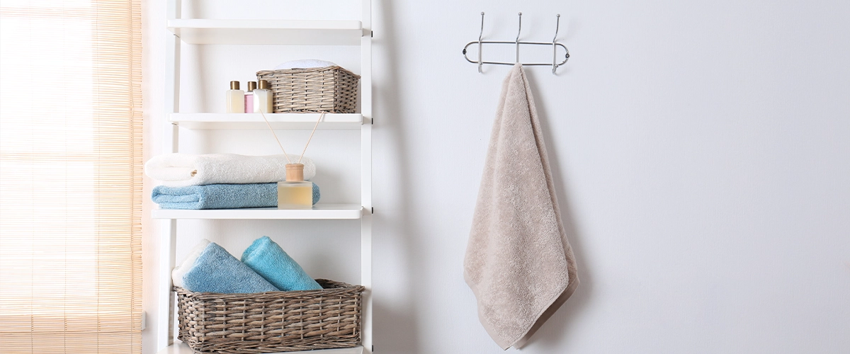 Open shelving and a towel hanging from a hook