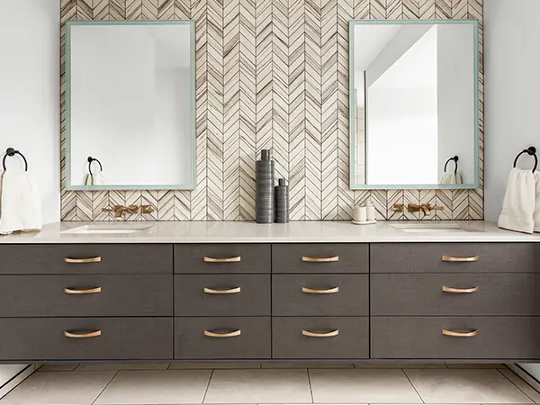 A double vanity in a dark beige color with two square mirrors