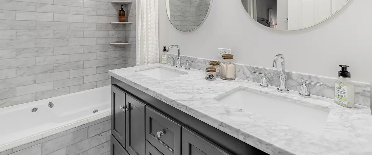 A marble countertop in a white bathroom