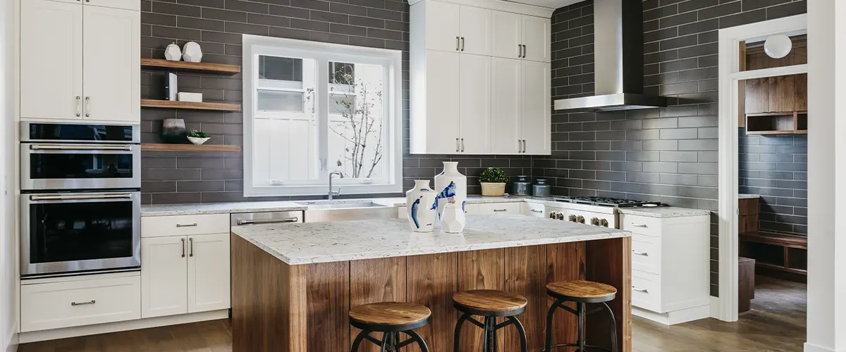 modern kitchen with wood island and white cabinets