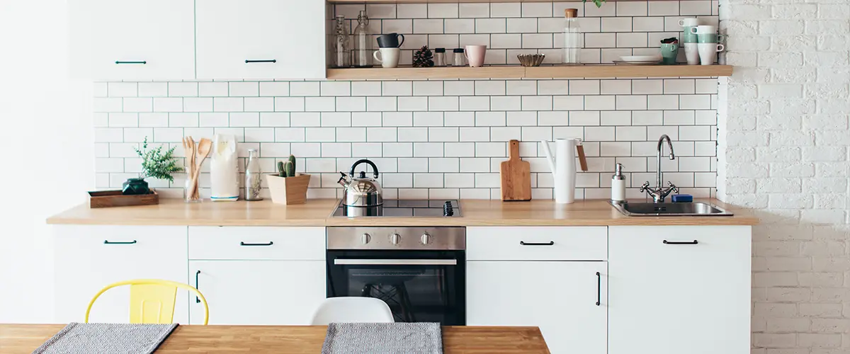 Traditional kitchen space with open shelves and butcher block countertops